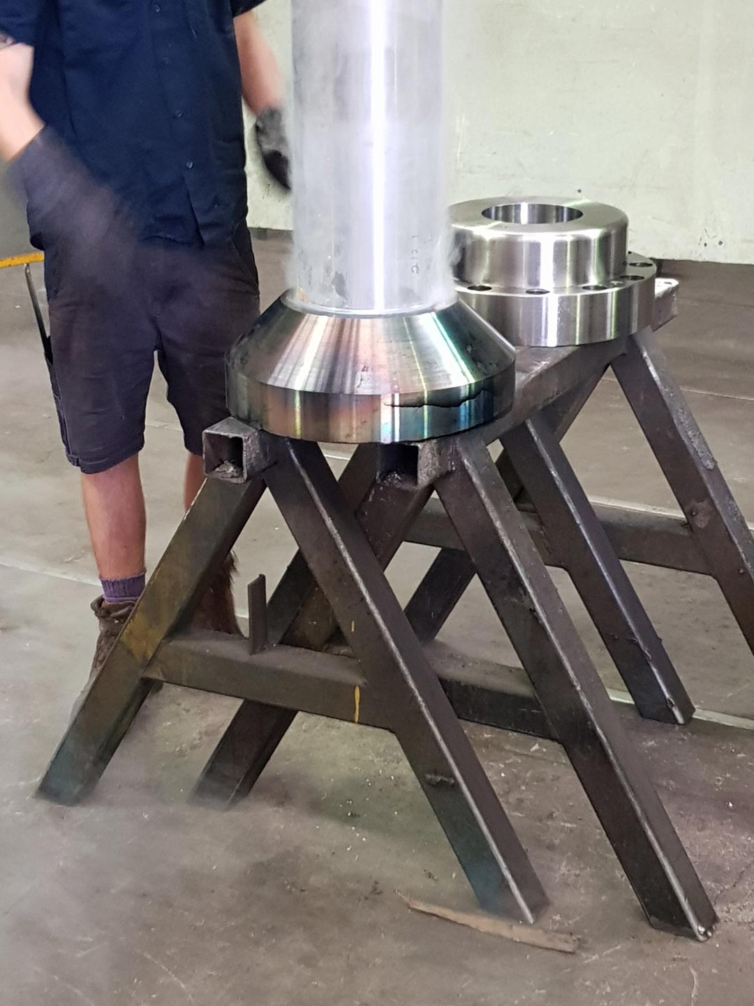 heated metal flange being pressed onto cold shaft